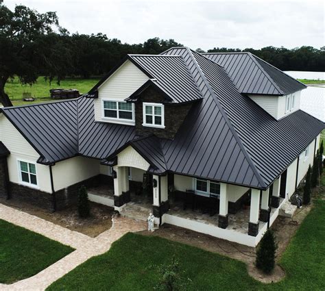 black metal roof with hemlock house|modern black metal roofing.